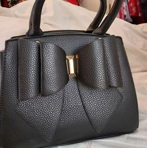 Like Dreams black purse with strap, bow, never used